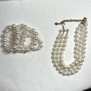 Elegant and timeless pearls, necklace by Carolee and four pearl bracelets